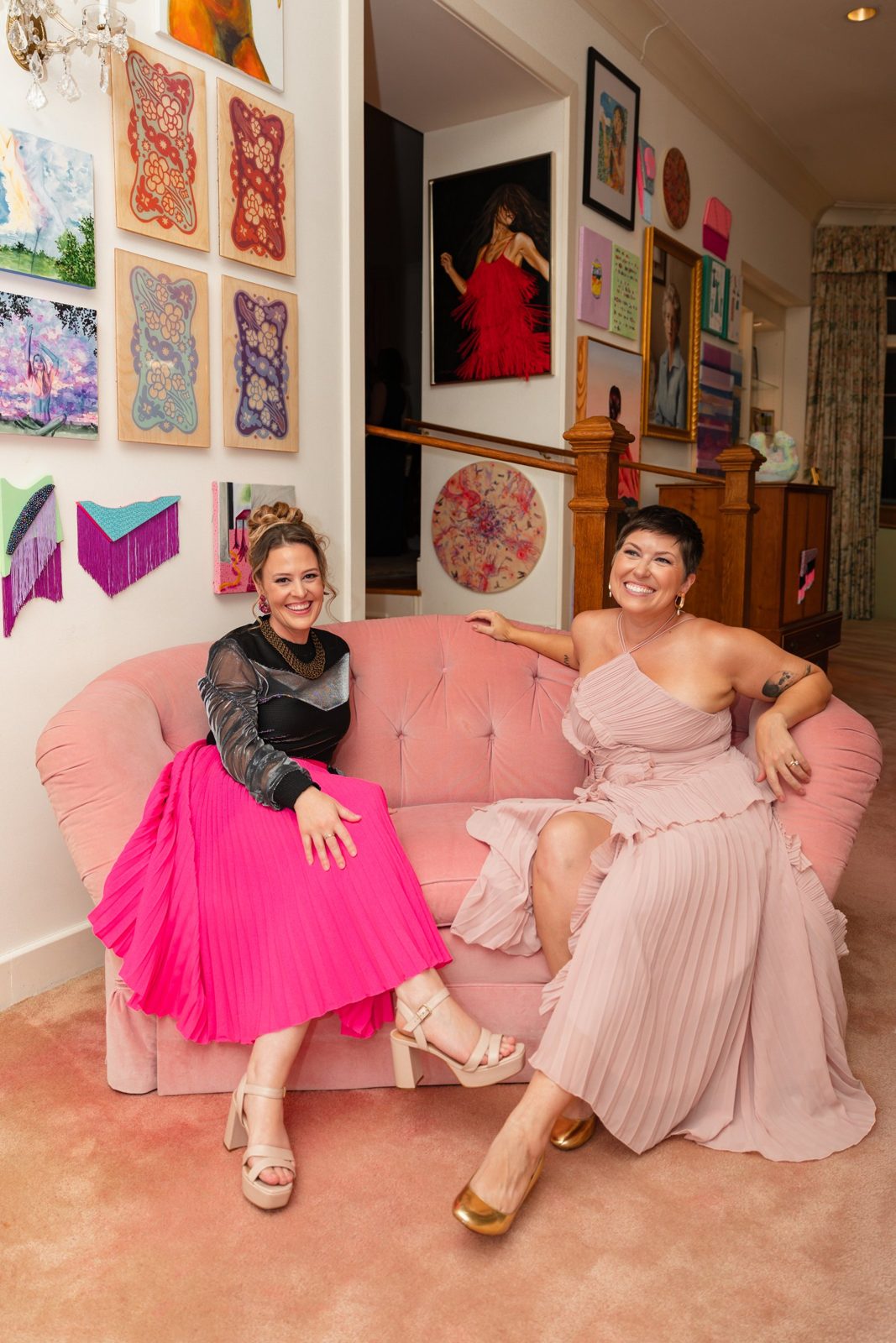Sarah Jamison and Stephanie Ervin, co-founders, on the pink sofa at the Girlism gala